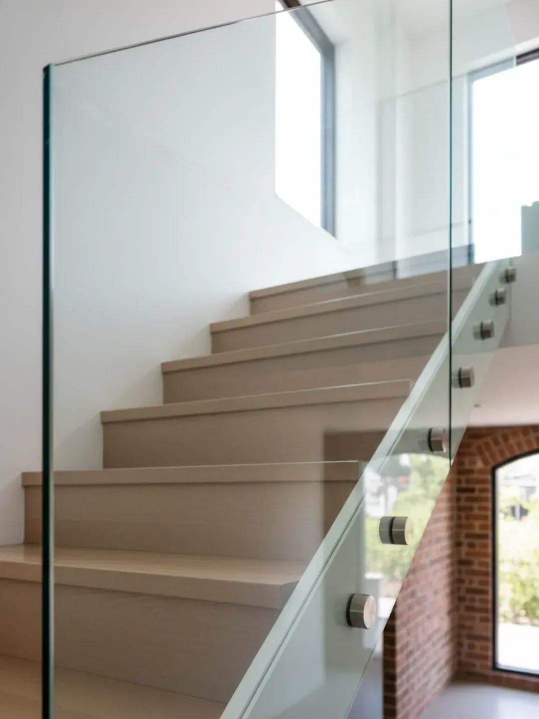 Pin-fixed standoff glass balustrades west end with floating glass effect using marine grade stainless steel fittings.