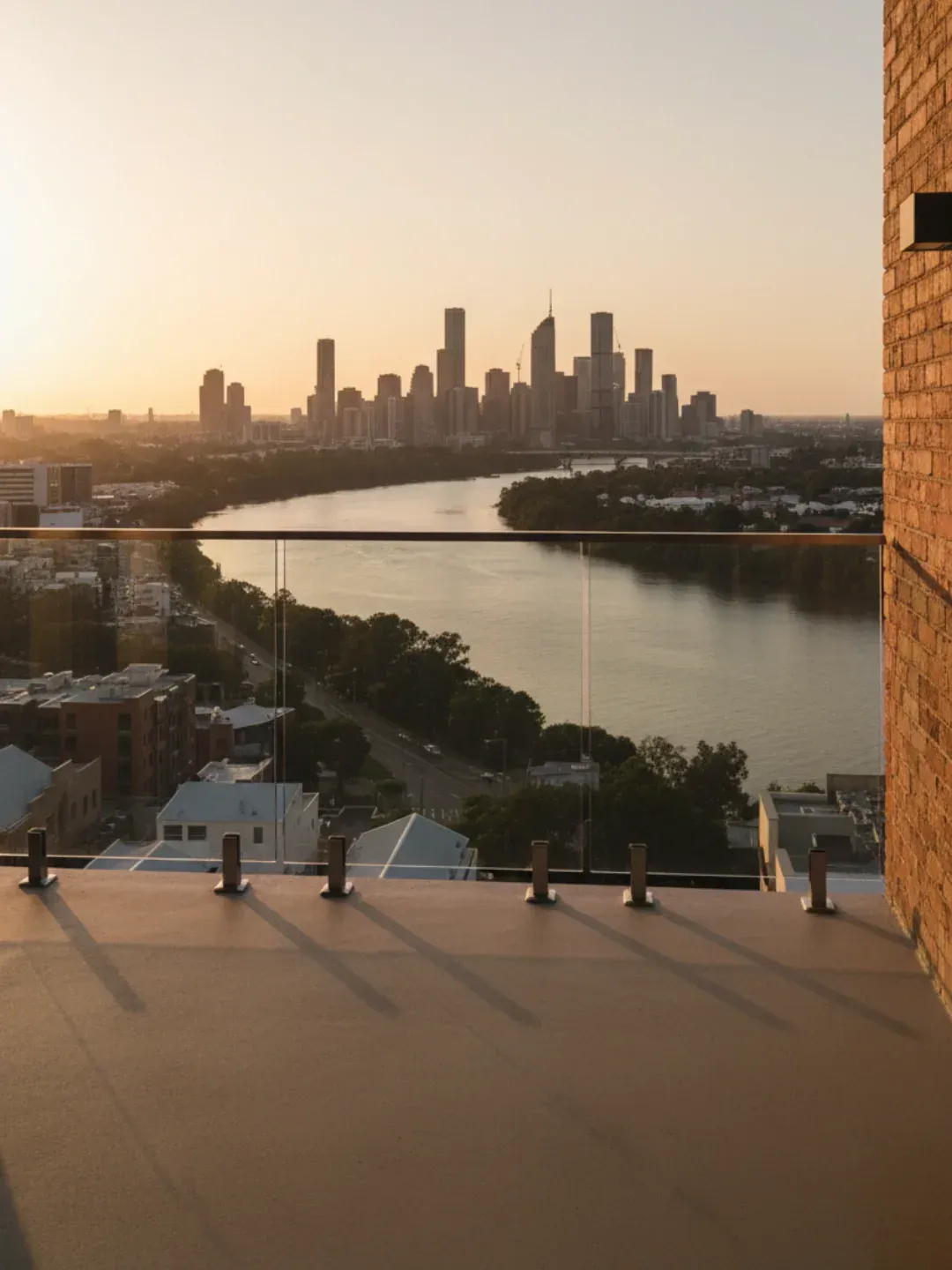 Modern frameless glass balustrades west end enhancing river and skyline views with safe compliant installation.